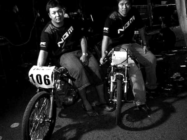 Two NGM team riders with race bib 106