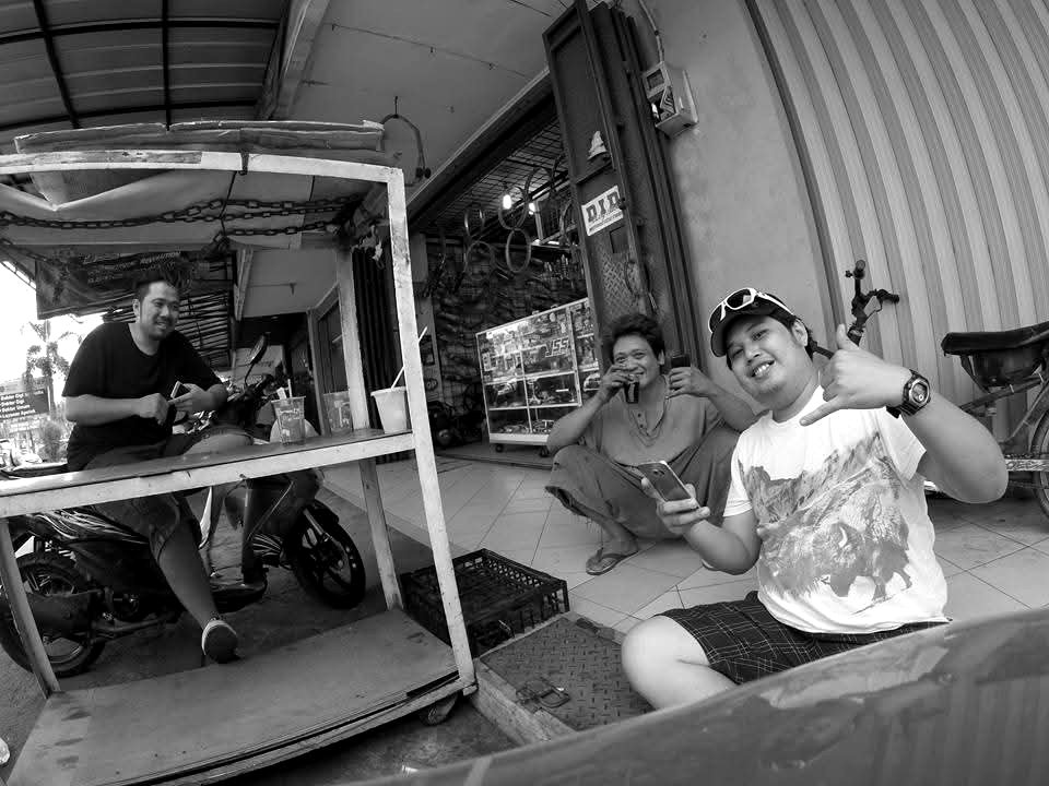 Team members sitting outside the shop
